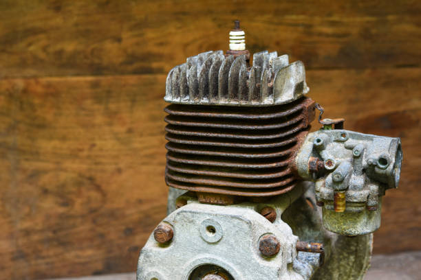 rusty and dirty cylinder block of a small two-stroke engine . Old two-stroke engine