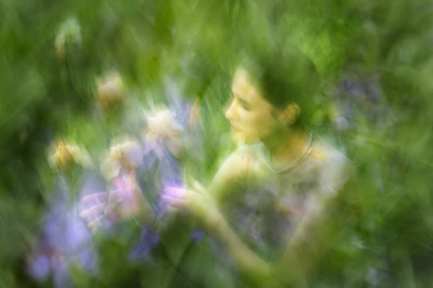 istock Woman is holding Iris Flowers 2171524286