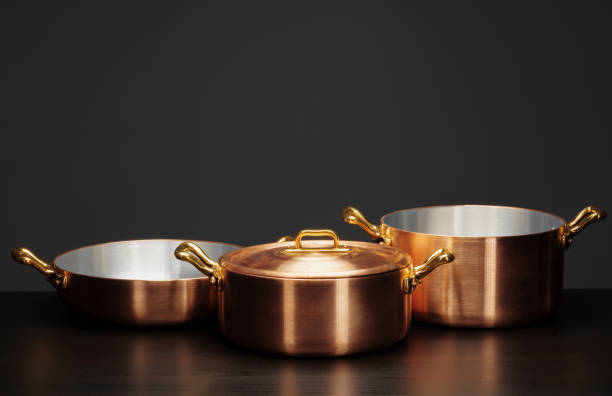 istock Shiny vintage copper cookware over dark background 2171524597