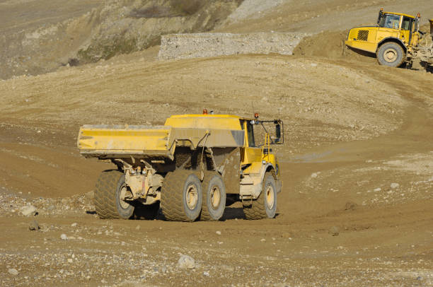 istock Yellow dump truck working in gravel pit 2171524614