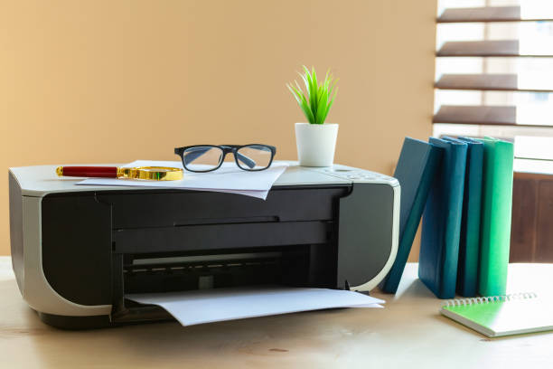 istock Close up of an office table with printer on it 2171525147