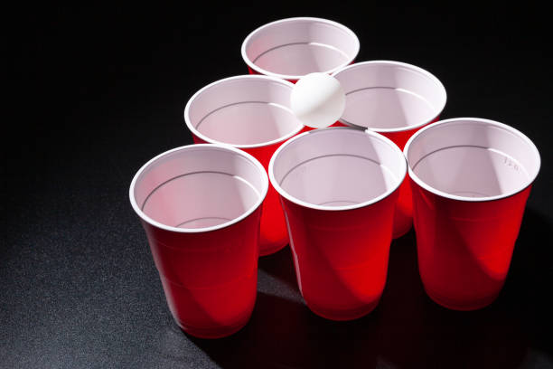 istock Beer pong college game on black background 2171525977