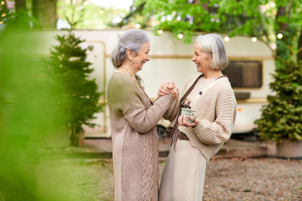 istock Joyful senior lesbian couple enjoying nature while camping in a serene forest 2171530653