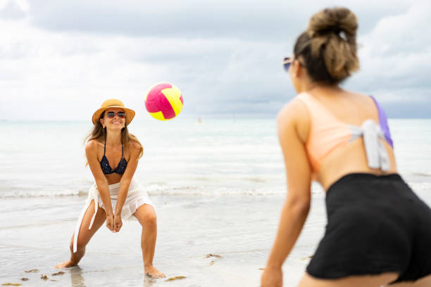 istock Women playing volleyball on the beach 2171531291