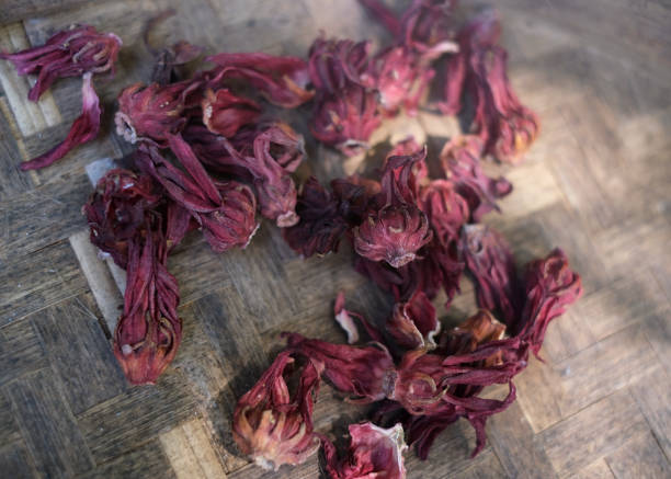 Close-up shot of Dried Roselle (Rosela) Plant. hibiscus sabdariffa, herbal tea, Roselle benefits, natural remedy, dried flowers, Roselle uses, antioxidants, herbal supplements, Roselle health benefits