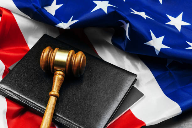 Gavel on wooden table with USA flag
