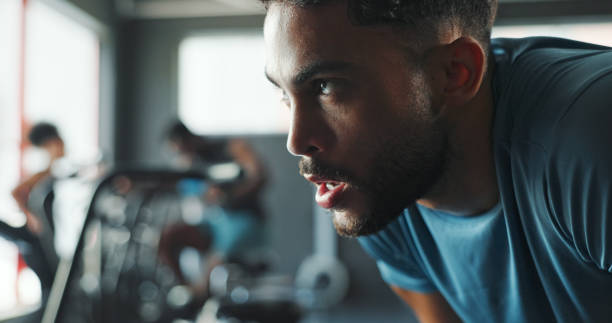 istock Exercise, thinking and tired with man in gym for break from intense training or workout. Breathing, fitness and sweating with exhausted athlete person in health club for challenge or performance 2171536360