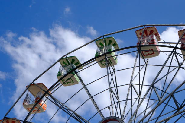 istock Cloudy sky and amusement park fun ferris wheel 2171578486