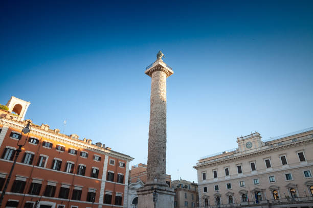 Picture of the column of marcus aurelus in rome. The Column of Marcus Aurelius is a Roman victory column in Piazza Colonna, Rome, Italy. It is a Doric column featuring a spiral relief: it was built in honour of Roman emperor Marcus Aurelius and modeled on Trajan's Column. The Column of Marcus Aurelius, located in Piazza Colonna, Rome, Italy, stands as a magnificent symbol of Roman imperial history. This Roman column is adorned with detailed carvings representing the emperors military campaigns and victories.