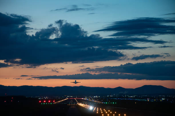 Jet plane taking off into the sunset sky