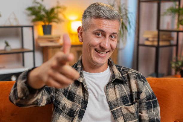 istock Happy satisfied man smiling pointing to camera, choosing lucky winner, indicating, inviting, approve 2171605845
