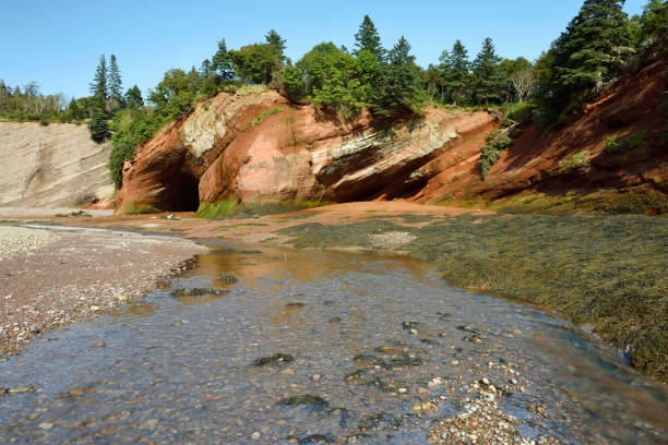 St.Martin cave on the rugged coastline of the Bay of Fundy, New Brunswick. The cave is only accessible by foot at low tide. This area is well known for one of the highest tide in the world.