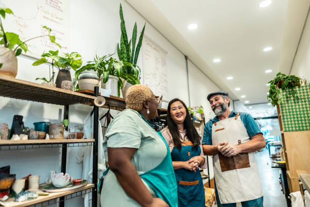 istock Potters friends talking on a ceramics workshop 2171608583
