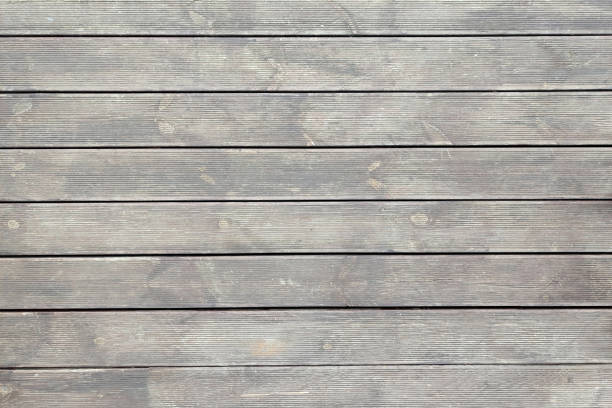 Old wooden dirty parquet floor texture background top view. High resolution photo. Full depth of field.