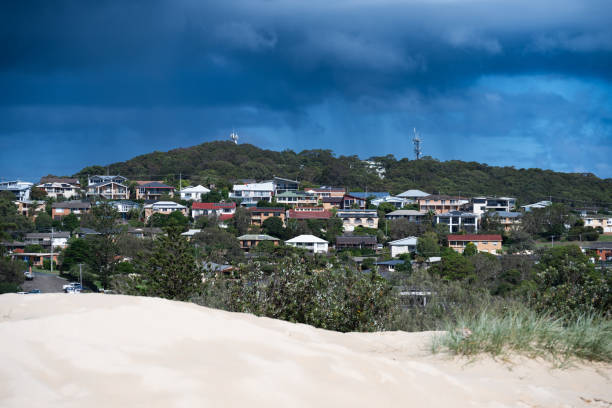 Aerial view overlooking One Mile Beach at the city of Forster, Australia. Seen a warm summer day. In the background the residential district of the city of Forster.