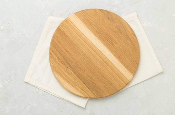 istock Cutting board with napkin on concrete background, top view 2171609859