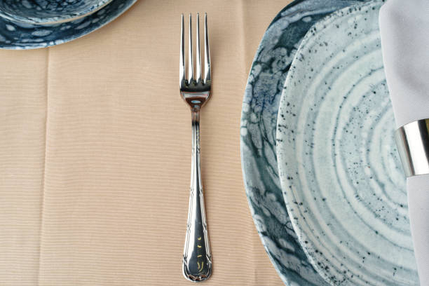 istock Details of a stylish table setting with textured ceramic dishes 2171610751