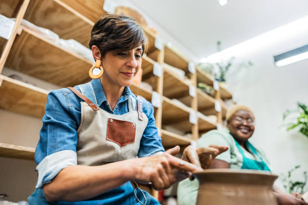 istock Mature woman making a craft product at ceramics workshop 2171611201
