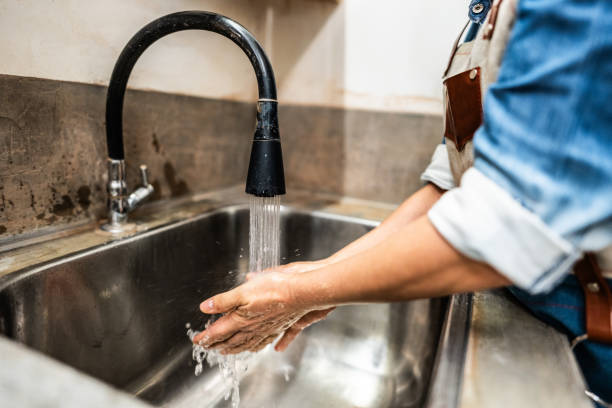 istock Woman washing hands at ceramics workshop 2171611208