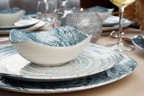 istock Details of a stylish table setting with textured ceramic dishes 2171611315