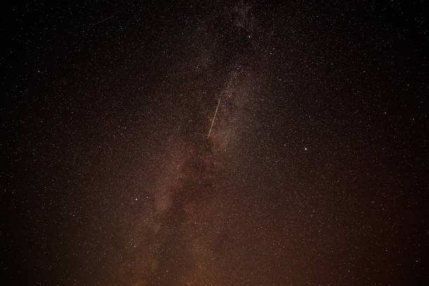 istock Perseid meteor crossing Milky way at night sky 2171611837