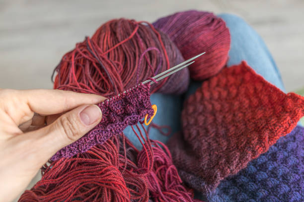 istock Homemade warm socks from bright colored yarn 2171614328