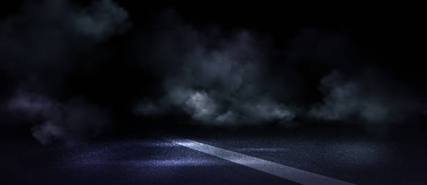 istock Wet asphalt road with mark line covered in smoke 2171614579