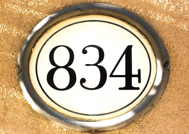Number 834 Street Address on Pink Wall