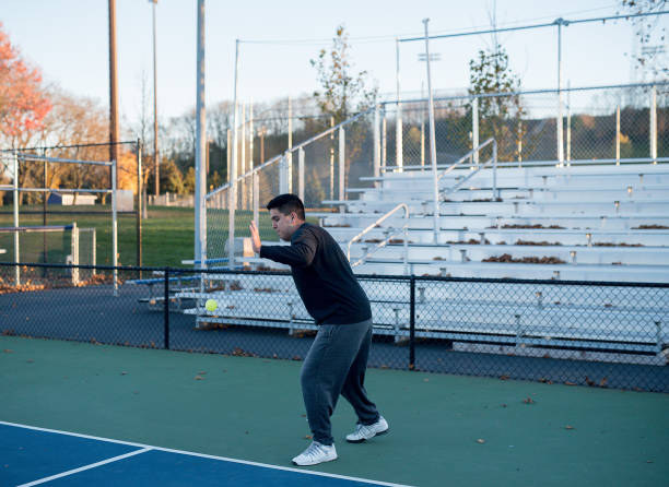 istock Hispanic brothers playing pickleball outside 2171616494