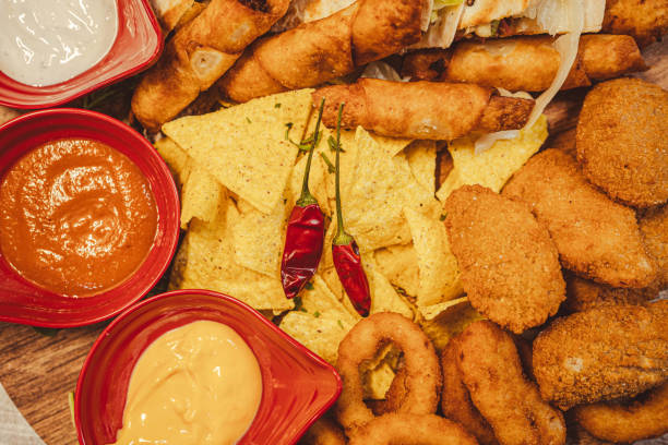 istock Selected dishes from Mexican cuisine quesadilla, taquitos, chips and sauces, fried onion, jalapenos for two people 2171618044