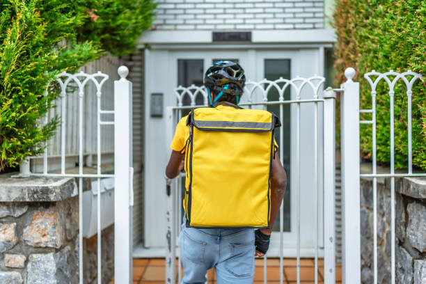 istock Rear view of a delivery man at destination 2171619655
