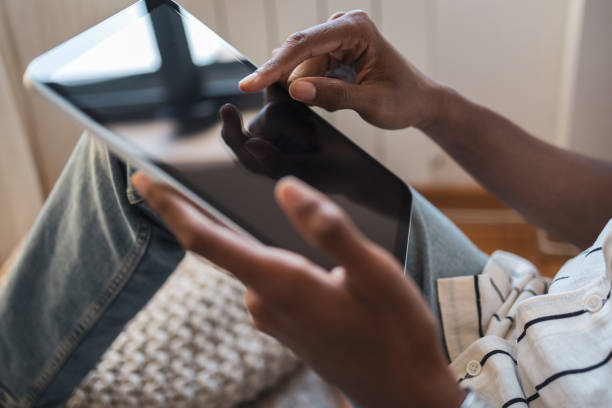 istock Person using digital tablet at home in casual setting 2171619959