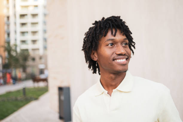 istock Smiling young man enjoying a sunny day outdoors 2171619967