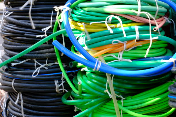 Colorful garden irrigation hoses in rolls sold in hardware stores.\nGarden care for gardeners.