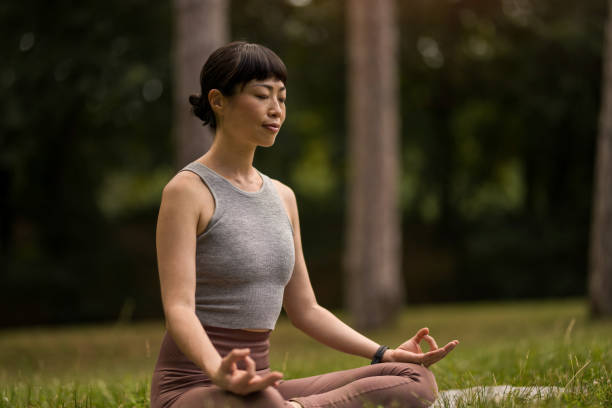 istock Woman meditating in nature. 2171622287