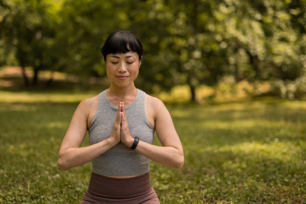 istock Woman doing yoga in nature. 2171622489