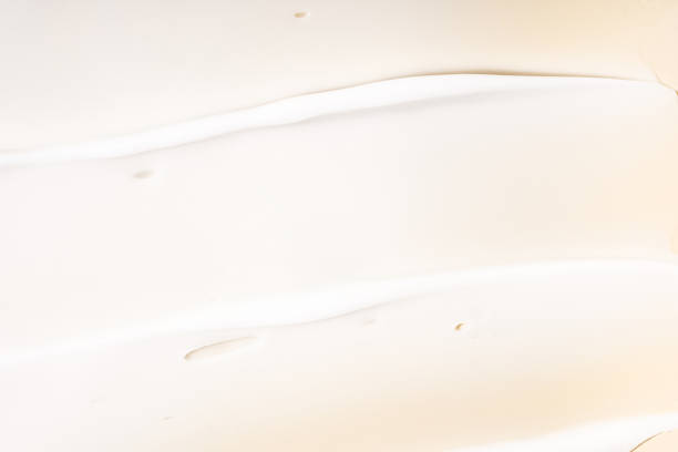 istock Texture of white cream on beige background 2171622964