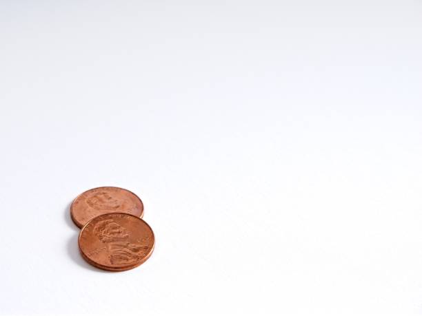 Advice concept with two pennies on white background