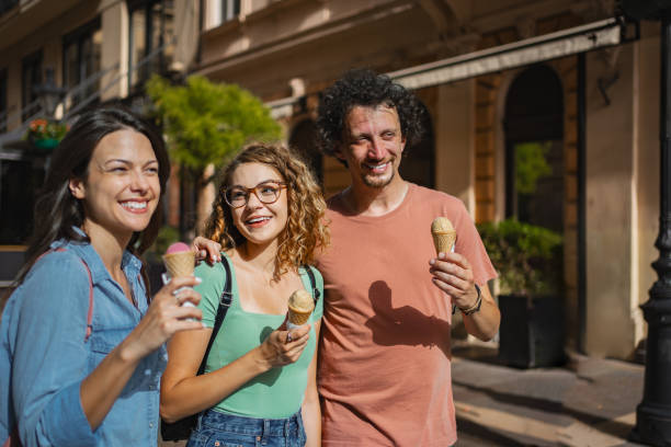 istock Three friends enjoying ice cream while exploring the vibrant streets of Budapest on a sunny afternoon in the heart of the city 2171623402