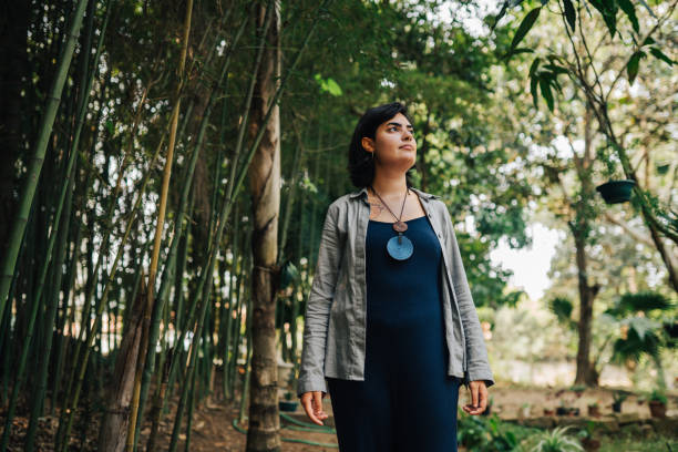 istock Reflective woman, sitting in the nature 2171624349