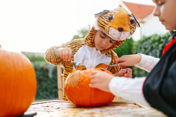 istock Carving a pumpkin for Halloween 2171625599
