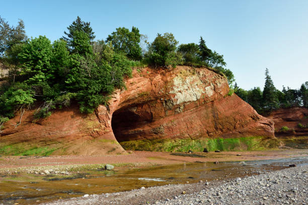 St.Martin cave on the rugged coastline of the Bay of Fundy, New Brunswick. The cave is only accessible by foot at low tide. This area is well known for one of the highest tide in the world.