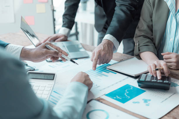 istock ​​Multi-national sales team meets with the director, young professionals discuss work problems, analyze financial statistics, share creative brainstorming solutions. 2171629484