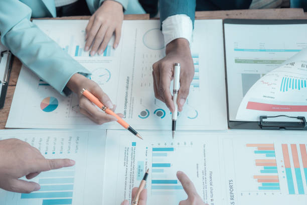 istock ​​Multi-national sales team meets with the director, young professionals discuss work problems, analyze financial statistics, share creative brainstorming solutions. 2171629486