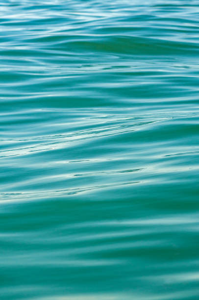 istock blue and aquamarine ocean texture moving waves 2171633114