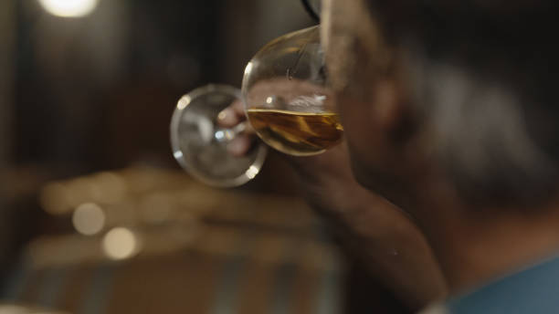istock Mature Man Tasting Wine in Cellar 2171640231