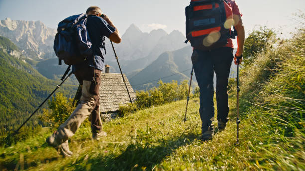 istock Active Senior Couple Trekking by Mountain Lodge 2171640327