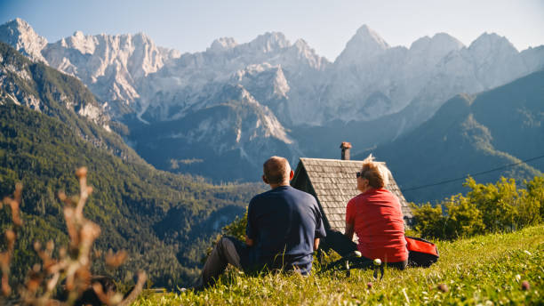 istock Elderly Couple Resting on Mountain Hike 2171640360