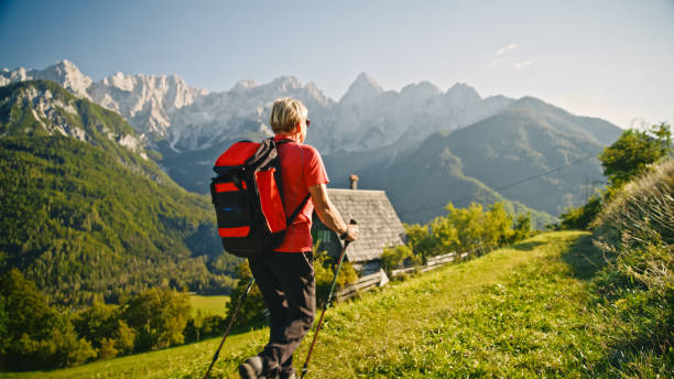 istock Elderly Woman Trekking in Mountainous Terrain 2171640366