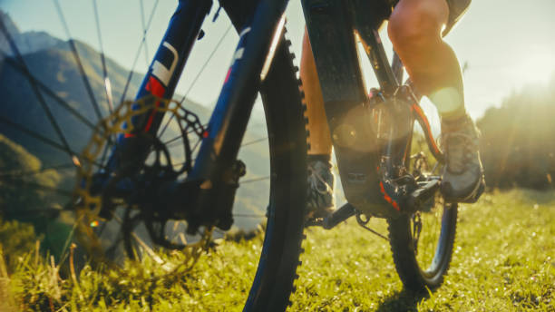 istock Female Cyclist's Sunset Mountain Biking Adventure 2171640404